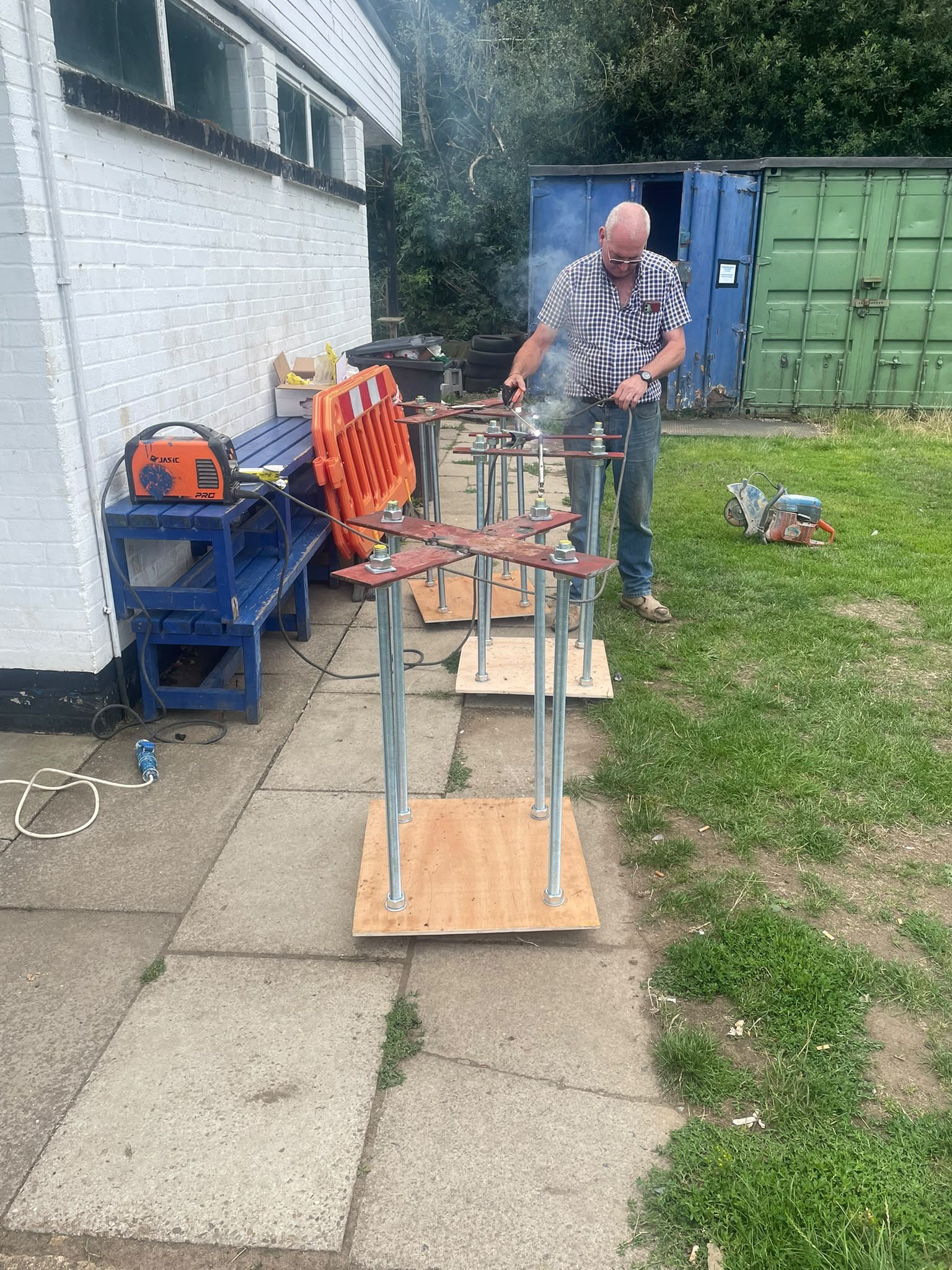 Fabrication of structural steel base plates for net posts