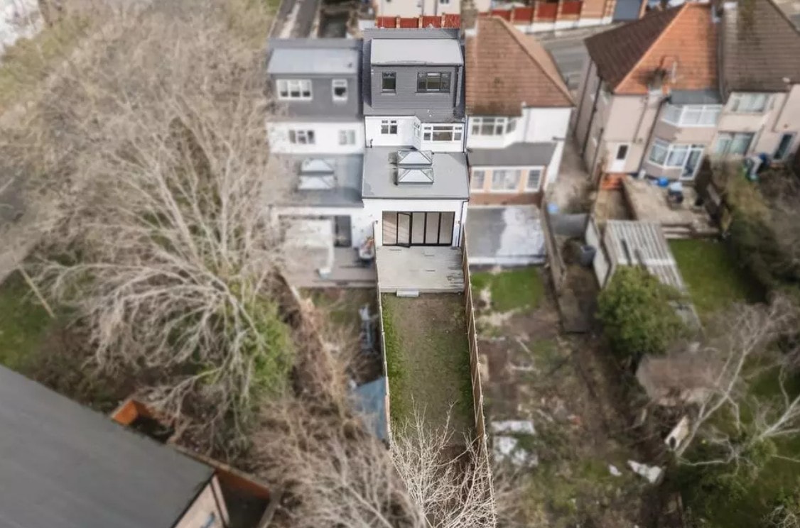 Hillside — aerial view of completed rear extension with flat roof, skylight and bifold doors to garden