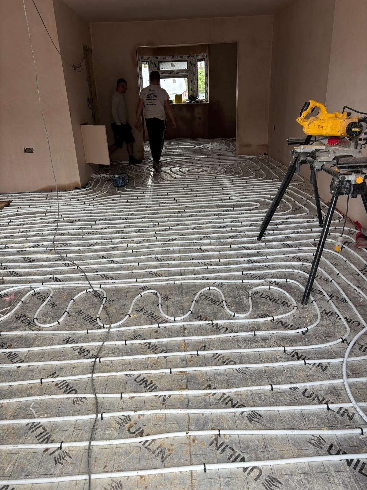 Pursley Road — underfloor heating pipework installation across the ground floor slab during construction