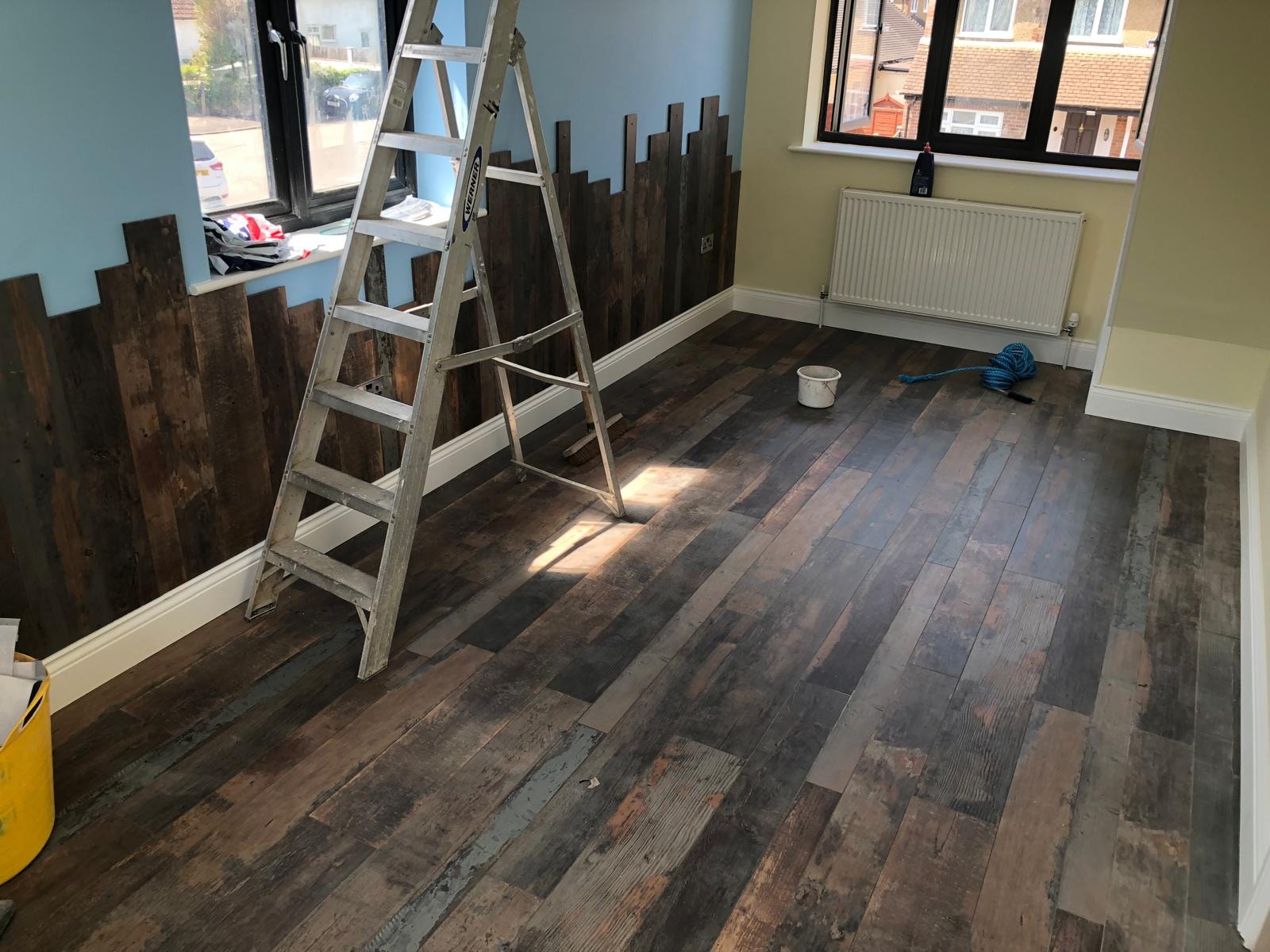 Room during refurbishment with new hardwood flooring